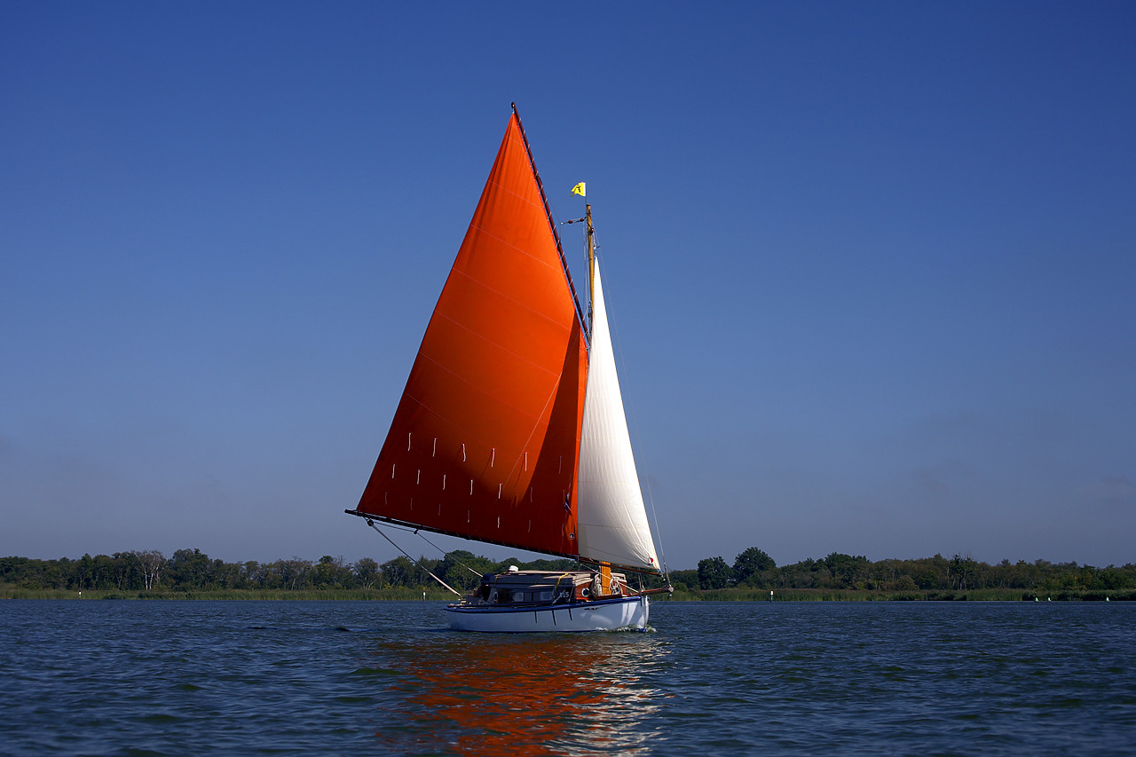 #060207-1 - Red Sailboat on Barton Broad, Norfolk Broads National Park, Norfolk, East Anglia, England