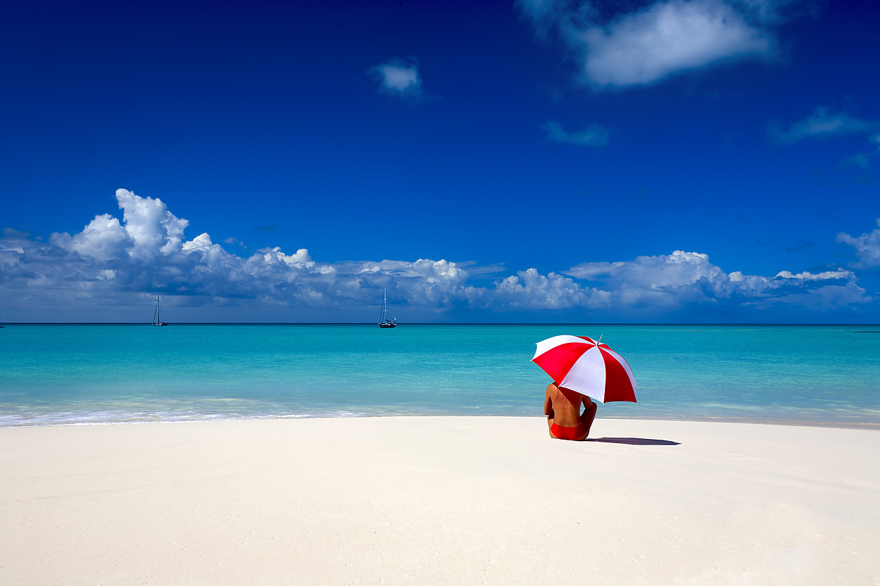 #070003-2 - Woman Sitting on Beach with Red & White Umbrella, Barbuda, Caribbean, West Indies