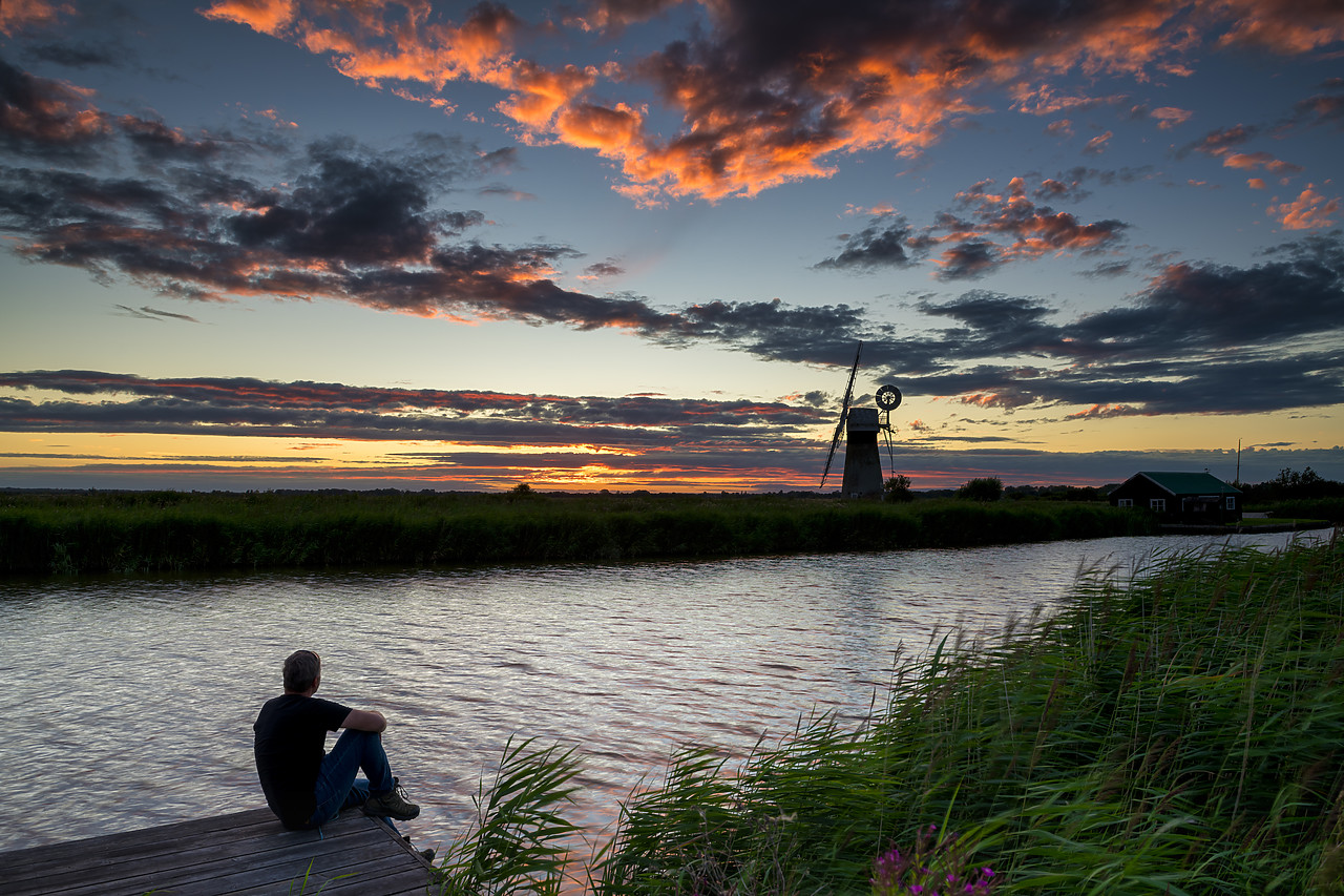 #400163-1 - Person Enjoying Sunset by River Thurne, Norfolk Broads National Park, Norfolk, England