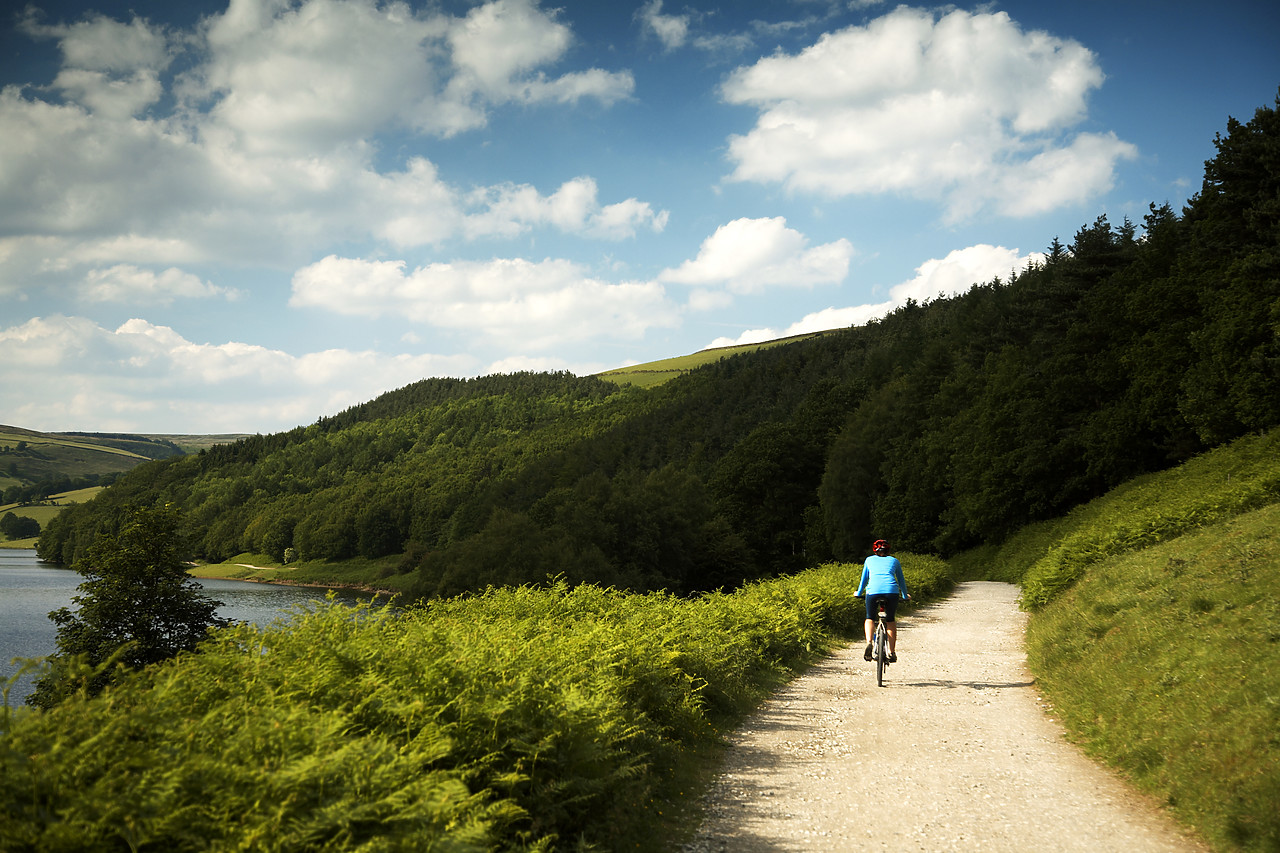 #060164-1 - Mountain Biker by Derwent Water, Peak District National Park, Derbyshire, England