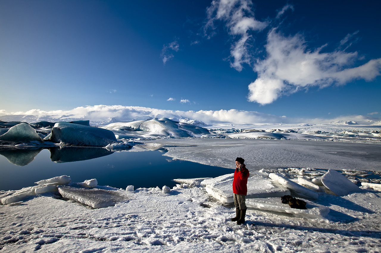 #100081-1 - Man Talking on Mobile Phone, Jškuls‡rl—n Iceberg Lagoon, Iceland