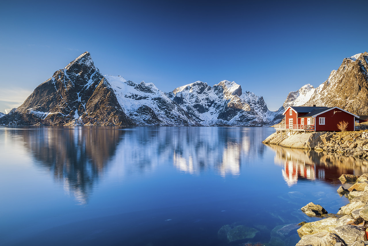 #150136-1 - Olstinden and Red Fishing Cabin Reflections, Lofoten Islands, Norway